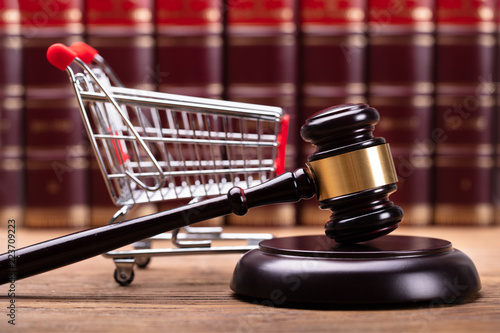 Photography Close-up Of Gavel And Shopping Cart
