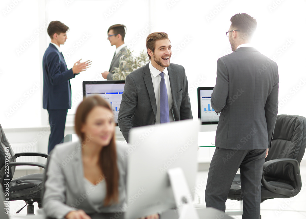 Group of business partners interacting during break Group of business partners interacting during break