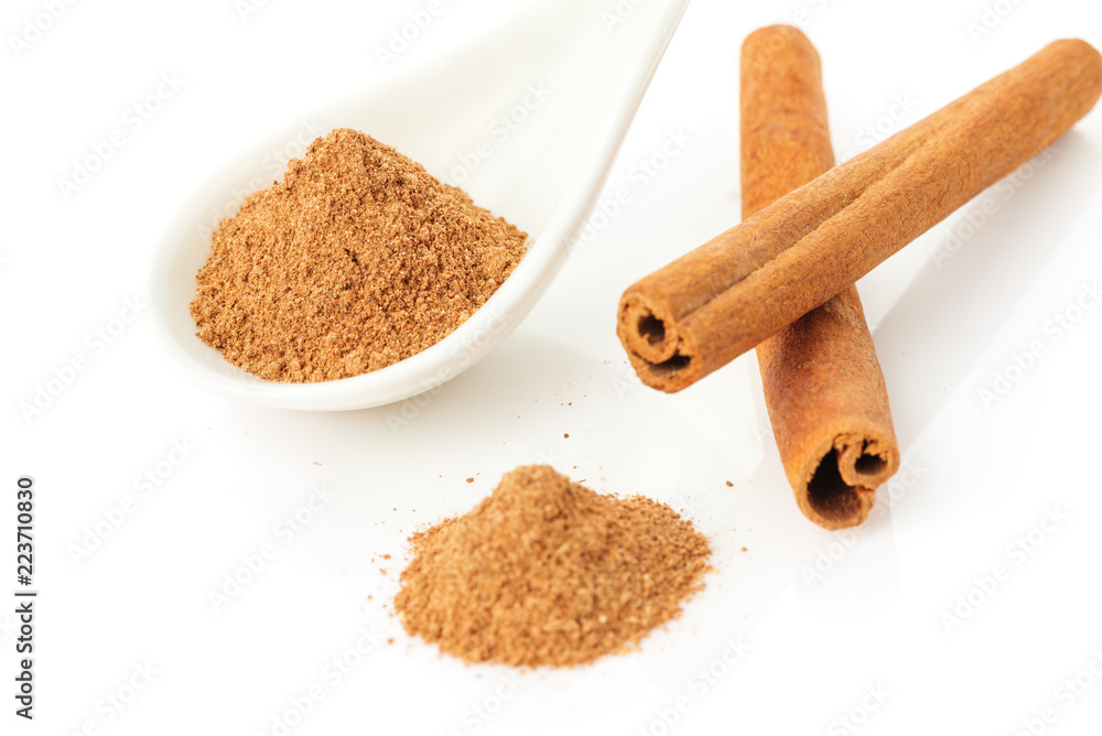 Cinnamon sticks and powder on white Cinnamon sticks and powder on white
