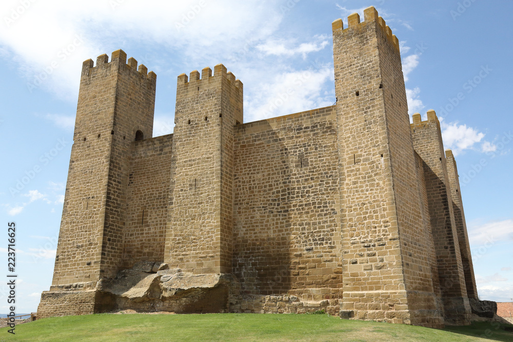 The middle ages stone made ancient castle Castillo de los Bañales, with towers and defensive merlons, in Sabada, a small typical rural town in the Aragon region, Spain