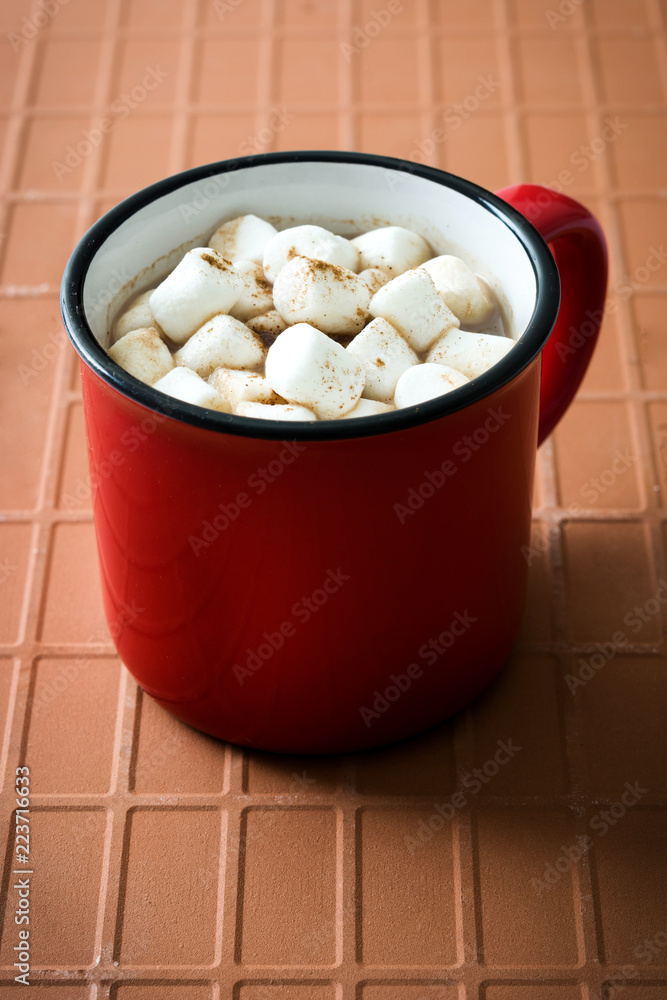 Christmas cocoa with marshmallow in mug on brown background Christmas cocoa with marshmallow in mug on brown background