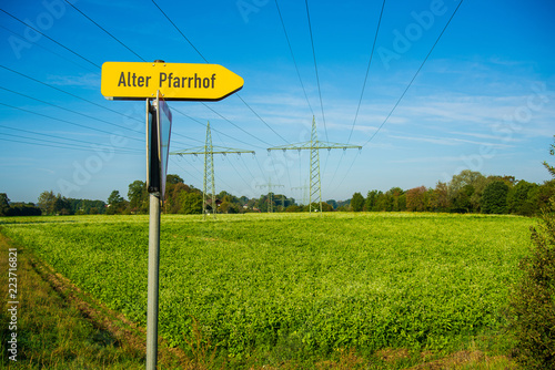 View of power transmission towers crossing through the bavarian countryside