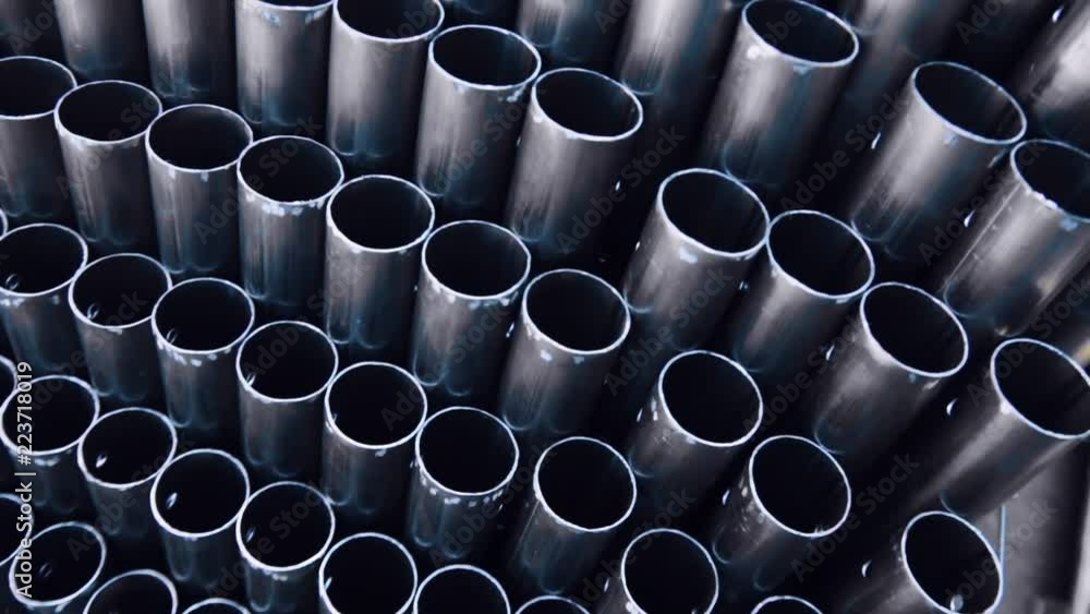 Metal profile pipe of round section in packs at the warehouse of metal ...