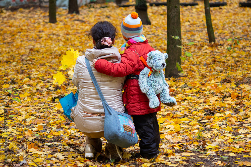 Mom and son are walking around and autumn Park. People Mom and son are walking around and autumn Park. People