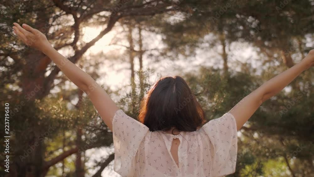 Free happy woman in forest enjoying nature. Natural beauty girl outdoor in freedom enjoyment concept. Mixed race Caucasian Asian girl posing on travel vacation holidays in dress. Slow motion 4k Free happy woman in forest enjoying nature. Natural beauty girl outdoor in freedom enjoyment concept. Mixed race Caucasian Asian girl posing on travel vacation holidays in dress. Slow motion 4k