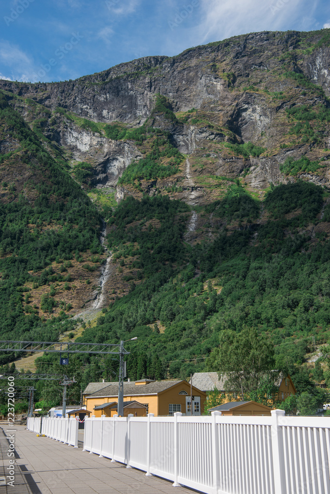 houses and bridge in Flam village near beautiful mountains, Aurlandsfjord (Aurlandsfjorden), Norway houses and bridge in Flam village near beautiful mountains, Aurlandsfjord (Aurlandsfjorden), Norway