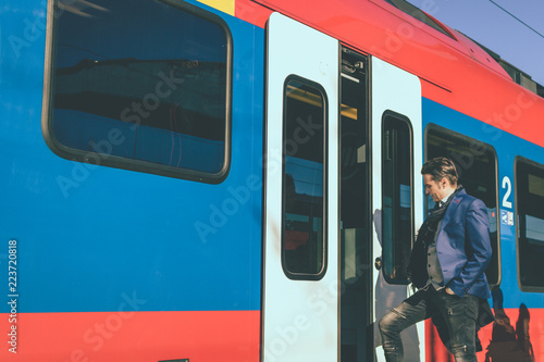 Entering the train and commuting to work.