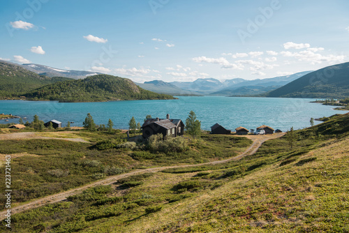 wooden buildings in cozy village at Gjende lake, Besseggen ridge, Jotunheimen National Park, Norway photo