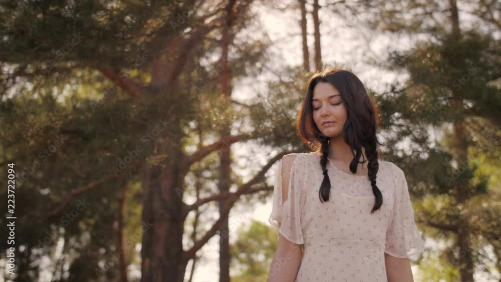 Free happy woman in forest enjoying nature. Natural beauty girl outdoor in freedom enjoyment concept. Mixed race Caucasian Asian girl posing on travel vacation holidays in dress. Slow motion 4k Free happy woman in forest enjoying nature. Natural beauty girl outdoor in freedom enjoyment concept. Mixed race Caucasian Asian girl posing on travel vacation holidays in dress. Slow motion 4k