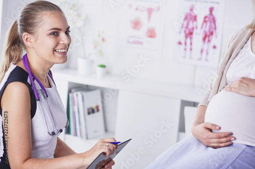 Gynecology consultation. Pregnant woman with her doctor in clinic