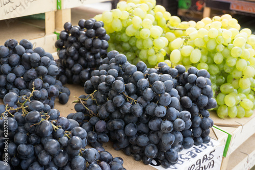 Fresh vegetables on stands of market in autumn