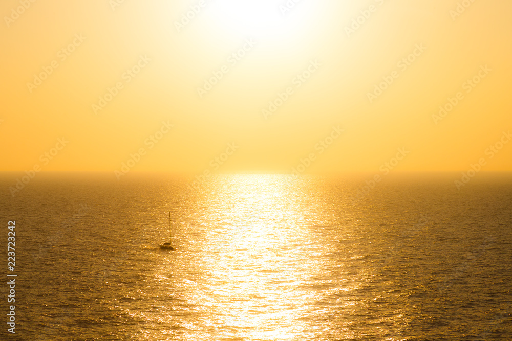 ocean sea and boat view at sunset from mediteranean greek cycladic island paros
