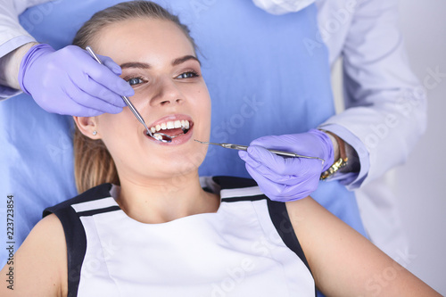 beautiful girl in the dental chair on the examination at the dentist