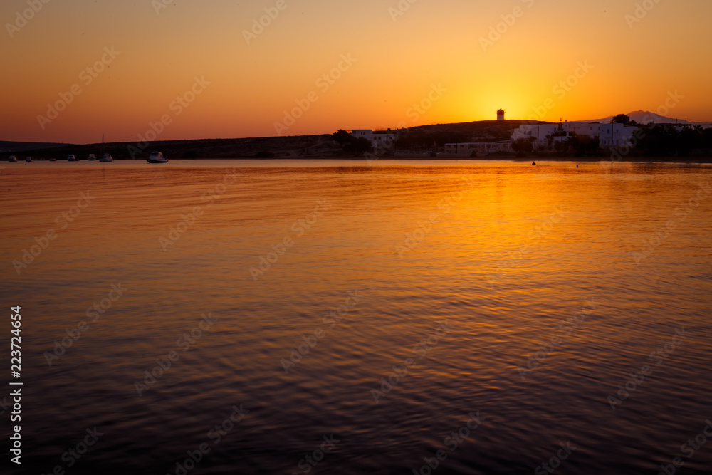 sunrise over lighthouse and sea in mediteranean greek cycladic island paros 3
