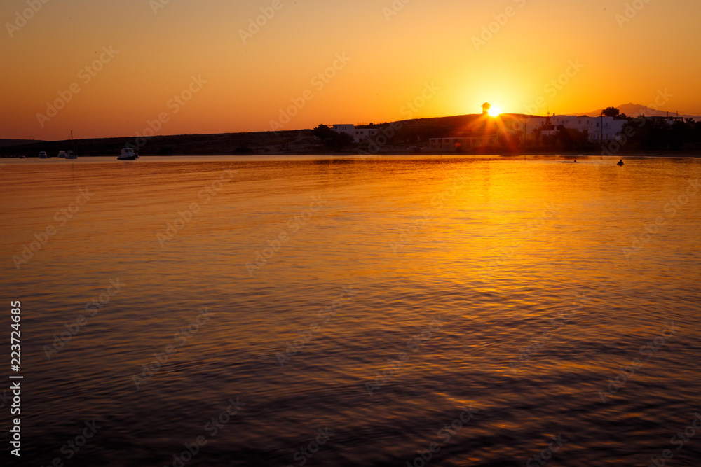 sunrise over lighthouse and sea in mediteranean greek cycladic island paros 2