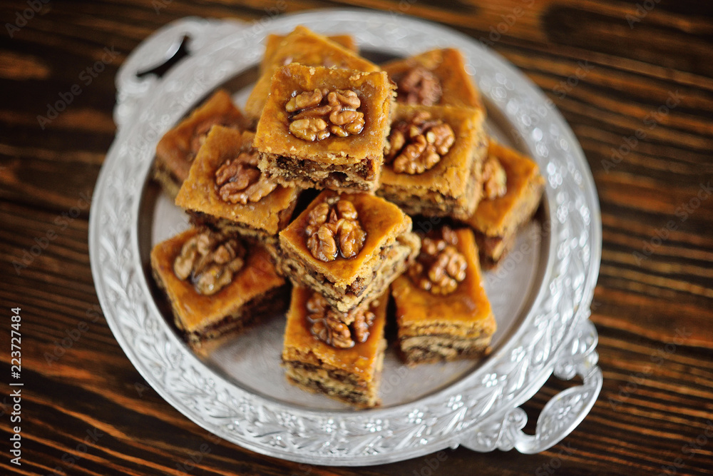 baklava - eastern confectionery made of puff pastry with nuts and honey. baklava - eastern confectionery made of puff pastry with nuts and honey.