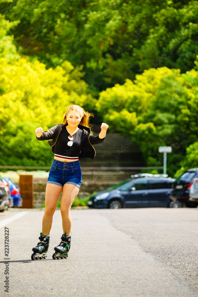 Young woman riding roller skates Young woman riding roller skates