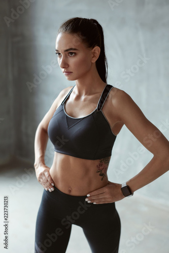 Sports Woman In Fashion Sportswear On Grey Background