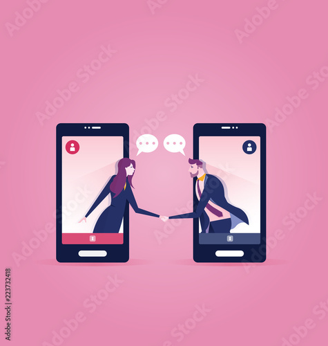 Two business people inside a smart phone, meeting with a handshake