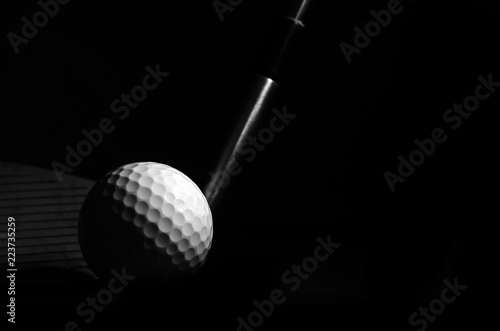 Golf balls and golf clubs to dark