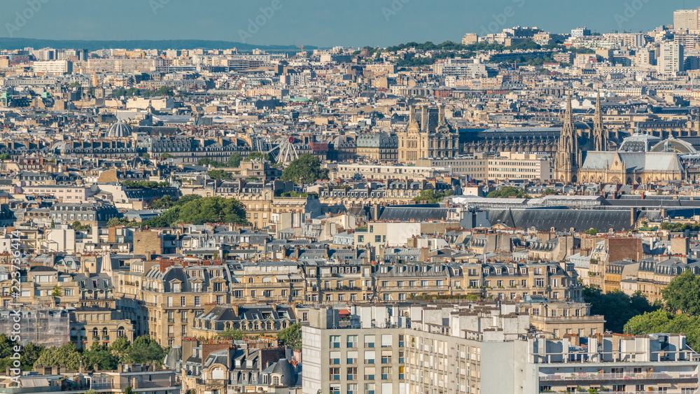 Aerial panorama above houses rooftops in a Paris timelapse