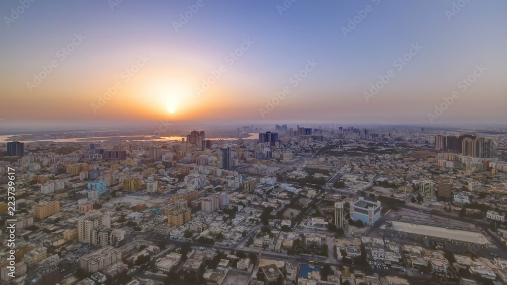 Sunrise with Cityscape of Ajman from rooftop timelapse. Ajman is the capital of the emirate of Ajman in the United Arab Emirates.