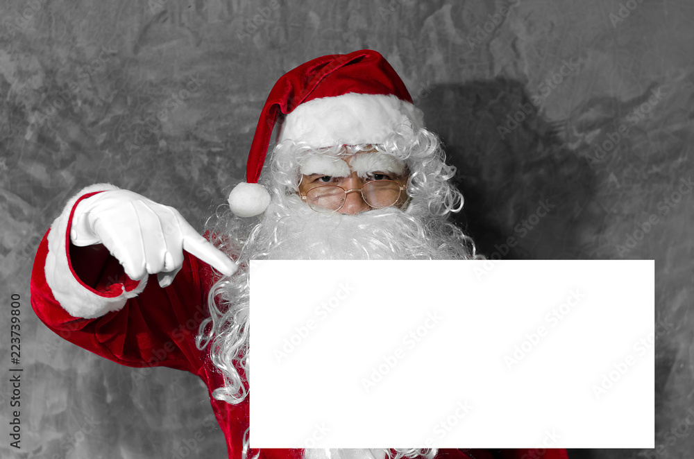 Naklejka premium Santa Claus is pointing the finger at white space