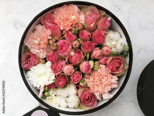 Flowers in a box and colorful almond cookies