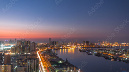 Cityscape of Ajman from rooftop day to night timelapse. Ajman is the capital of the emirate of Ajman in the United Arab Emirates.