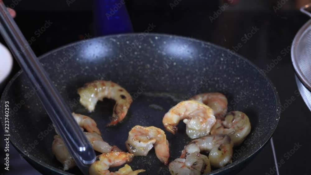 Hand of a chef cooking Italian Seafood pasta.Shrimp.
Hand of a chef cooking Italian Seafood pasta.Shrimp.
