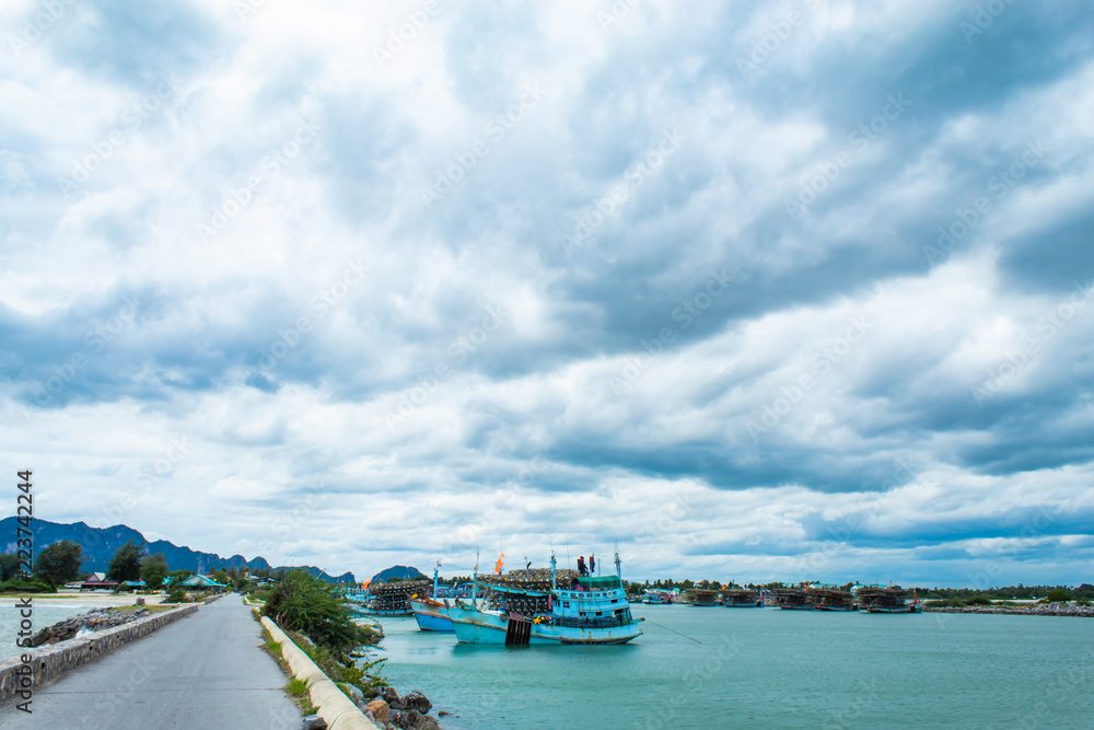 The fishing boat moored in the river access to the sea. The fishing boat moored in the river access to the sea.