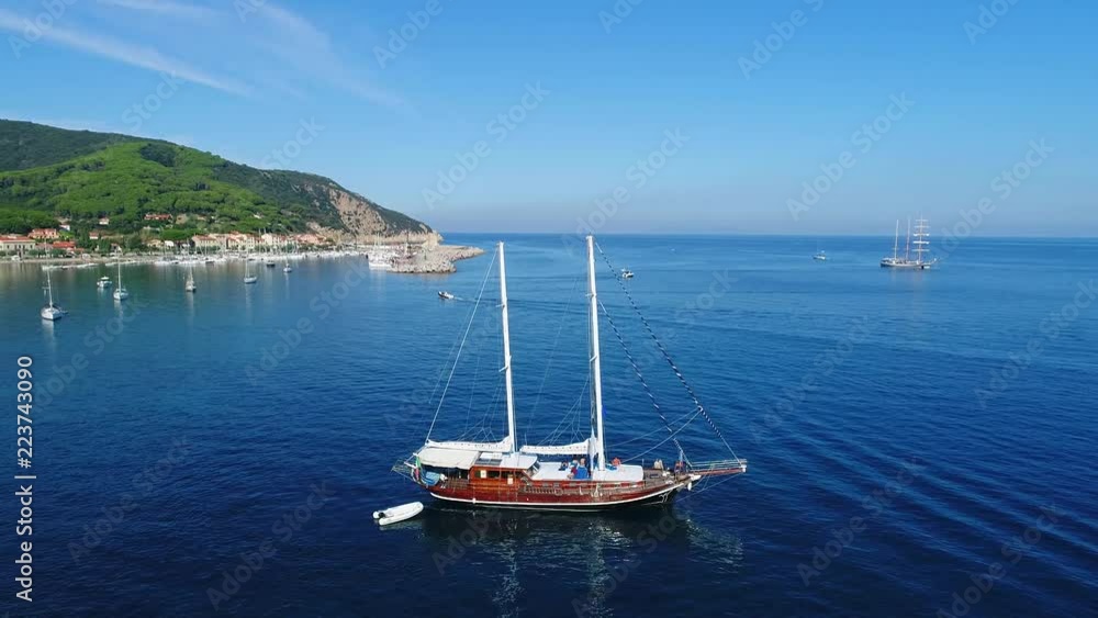 Sailboat in the Mediterranean sea, Island of Elba in Italy. Holidays in Italy Sailboat in the Mediterranean sea, Island of Elba in Italy. Holidays in Italy