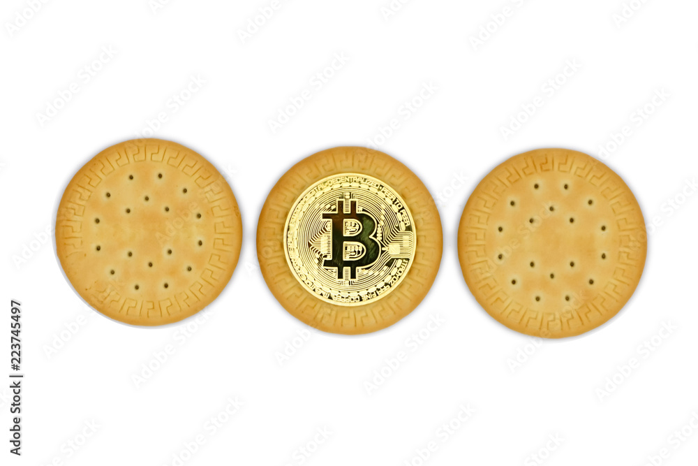 Fototapeta premium bitcoin and three cookies close-up, isolated