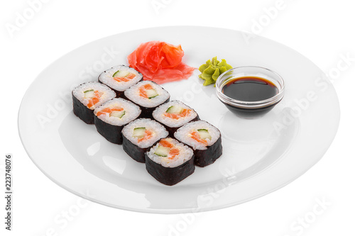 Sushi, rolls, hosomaki, with salmon, avocado, cucumber and Philadelphia cheese, raw seafood, soy sauce, marinated ginger and wasabi, food on plate, white isolated background Side view For the menu