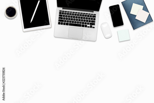 Flat lay photo of office table with laptop computer, digital tablet, mobile phone and accessories. on isolated white background. Desktop office mockup concept.