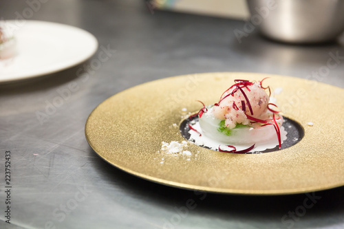 An ice cream sorbet desert prepared by a gourmet chef