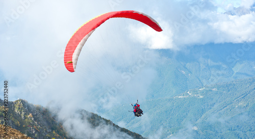 Paragliders over mountain