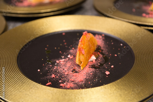 A pile of Taco shells in a restaurant to be used in a gourmet dinner. photo