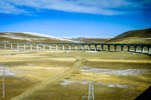 Qinghai-Tibet railway line, elevated above the icy permafrost of the Tibetan plateau near Lhasa photo