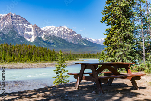 Picnic Table along the Bow River in Jasper National Park photo