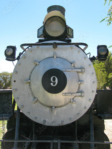 Front view of historic railroad locomotive 9, a 4-6-0 oil fueled steam engine, built in 1909 and used in gold mining days in the Owens Valley in the Eastern Sierra of California.