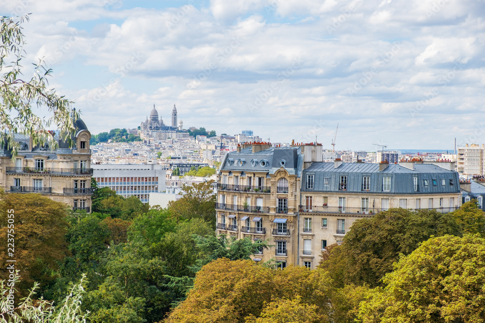 Paris skyline with Montmartre hill and Sacre Coeur Basilica in view.