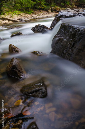 The waterfall on the long exposure in the Carpathian Mountain