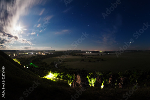 Night photo of the valley from the top of the hill. Place - area in the natural architectural archeological museum-reserve 