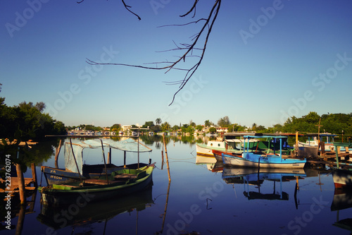 Photography Laguna del Cura in Cienfuegos, Cuba - a quiet bay with local fishing boats and c