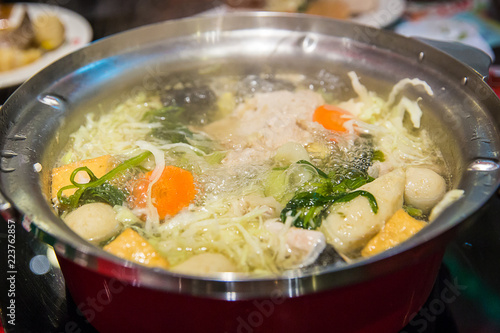 meat ball, meat and vegetable in sukiyaki pot boiled and steam, choose boiled food for healthy and avoid fried food and grilled food is concept. Selective focus Shabu Shabu and Sukiyaki, Japanese food