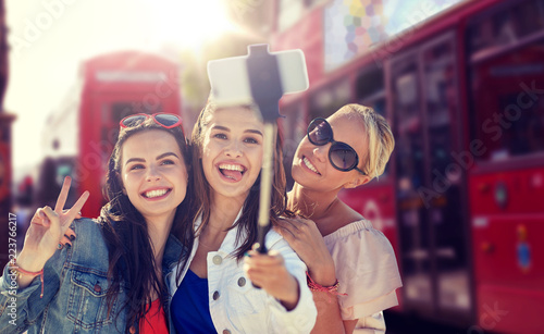 Photography summer vacation, holidays, travel, technology and people concept- group of smili