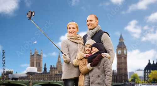 Photography family, travel and tourism concept - happy mother, father, daughter and son taki