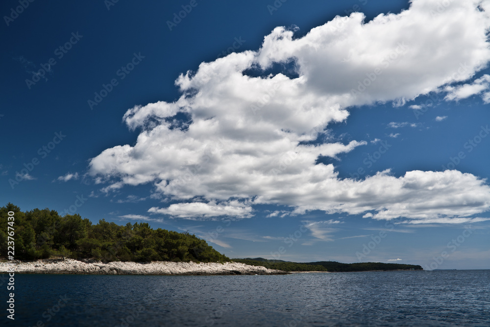 Island view in croatia, losinj, with some clouds in the sky Island view in croatia, losinj, with some clouds in the sky