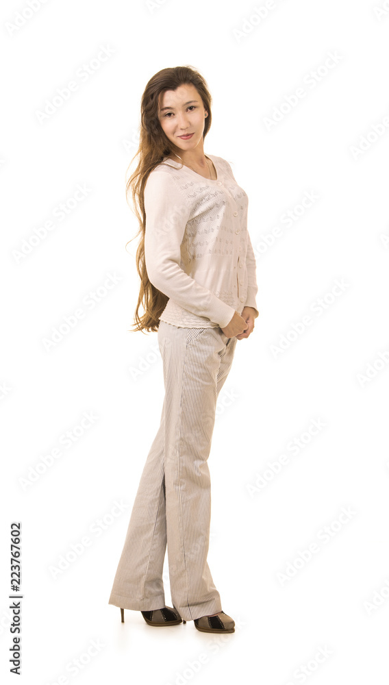 Emotions of a beautiful girl with long hair, in a white jacket posing in Studio on a white background. Emotions of a beautiful girl with long hair, in a white jacket posing in Studio on a white background.